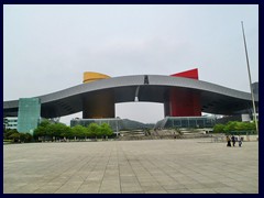 Shenzhen Civic Center or Citizen's Center is an enormous building complex, that is famous for its colourful exterior and curved roof. It opened in 2004 and was designed by John M. Y. Lee  and Michael Timchula and is one of the world's largest buildings and consists of two main halls, connected by a curved roof in the shape of a bird that can be passed underneath, after walking up through stairs. It houses the City Hall with 26 government agencies, as well as an exhibition center, a shopping mall, conference center and the interesting Shenzhen Museum. Around the complex you wil find a large park, Wongtee Plaza and Central Walk shopping malls, several large hotels, one of China's larges book stores, the Childrens Palace and the Shenzhen Library and Opera buildings. Concerts and performances are taking place in the area.